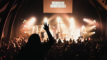 Worship service with a congregation and stage lighting