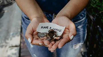 Volunteer collecting donations for a community campaign